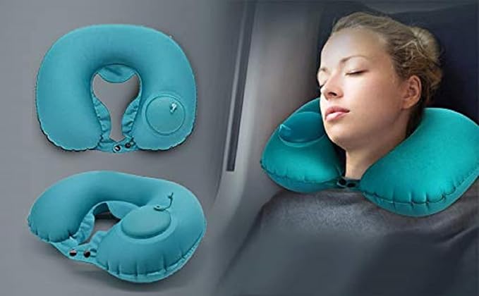 Deflated air neck travel pillow folded flat next to a compact travel bag